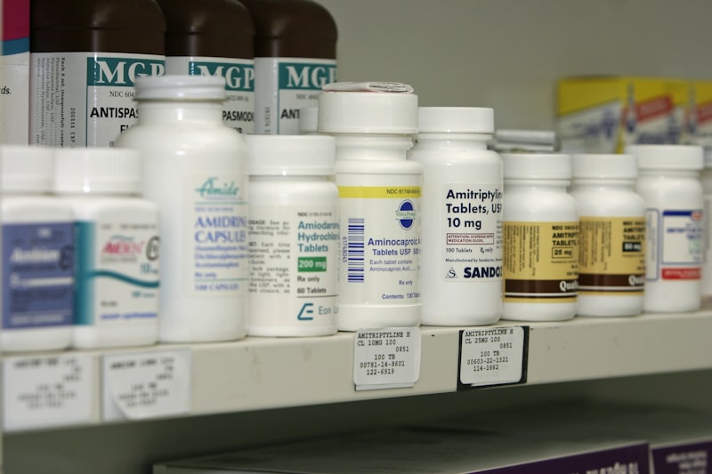 Calculator and prescription bottles representing cost comparison for medications