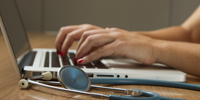 Person using a smartphone health app to manage prescriptions