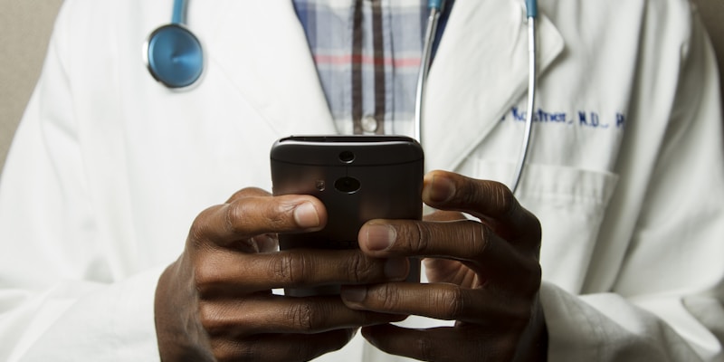Person comparing prescription drug prices on a smartphone at pharmacy
