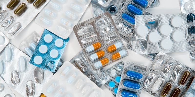 Pharmacist organizing generic medication bottles on a pharmacy shelf